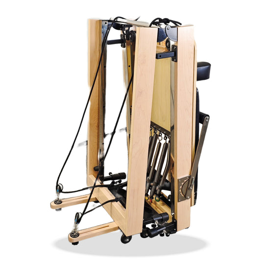 Pilatae Reformer Essential Pliable replié verticalement pour le rangement